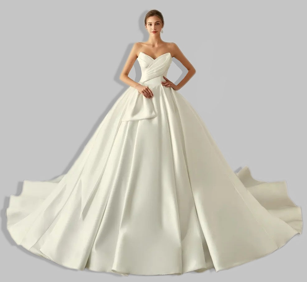 Elegant Satin A-Line Wedding Dress with Bow Detail and Dramatic Train