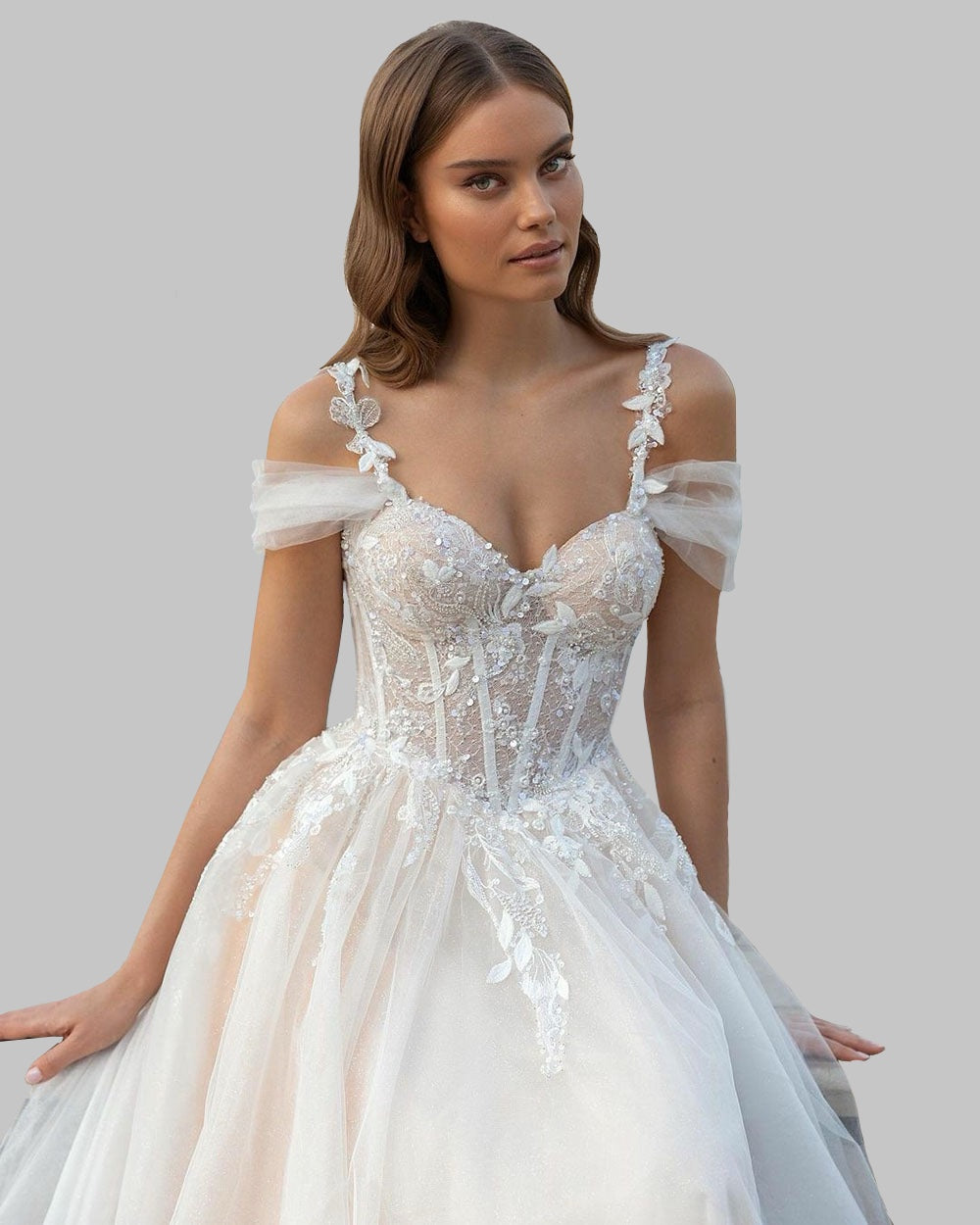 Elegant Off-Shoulder Wedding Dress with Intricate Lace Details