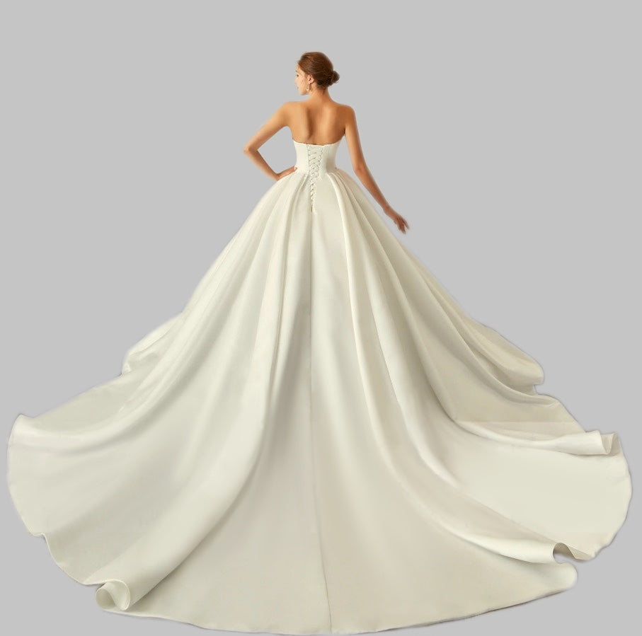 Elegant Satin A-Line Wedding Dress with Bow Detail and Dramatic Train